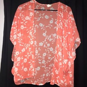 Peach, floral kimono with white flowers.